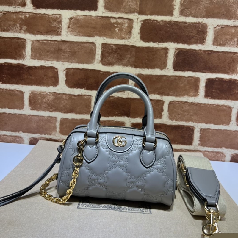 G*u*i top handle bags